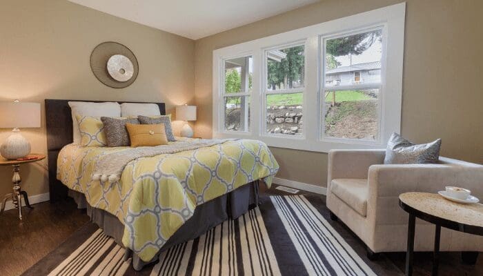 A bed that has been staged to sell a house.