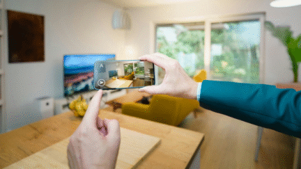 A person photographing a living room for a virtual real estate tour.