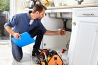 A home inspector completing a checklist in a home.