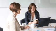 Two women going over an appraisal report.