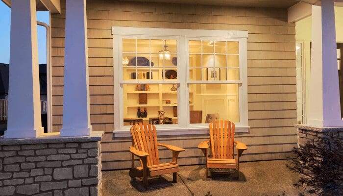 A porch that is staged outside a home for sale.
