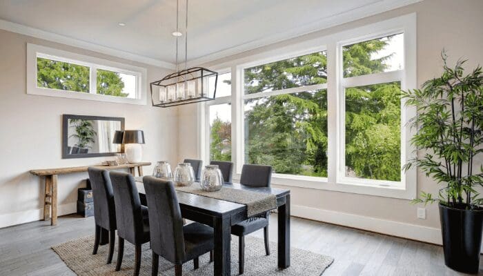 A dining room in a house that has been staged.