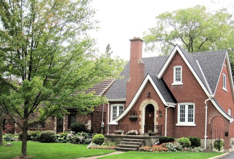 A red brick house with a front door.