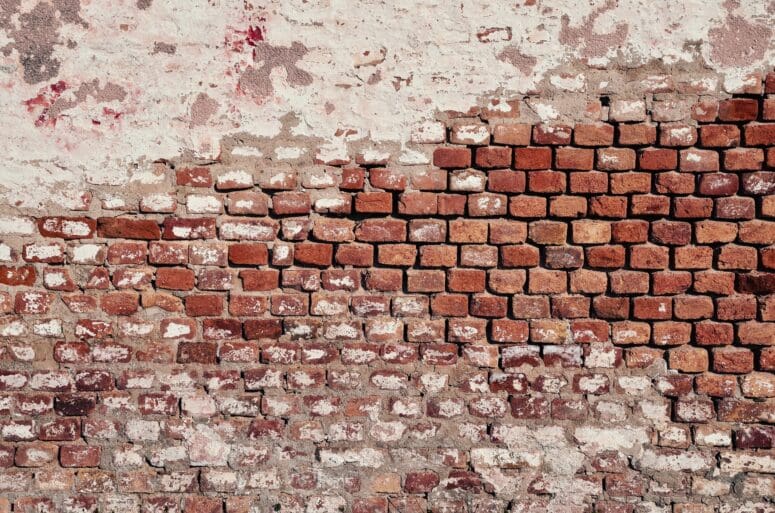 A brick wall with a red color.