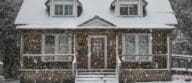 A house covered in snow during a winter snowfall that represents Top Agent Insights for Q4 2019