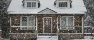 A house covered in snow during a winter snowfall that represents Top Agent Insights for Q4 2019