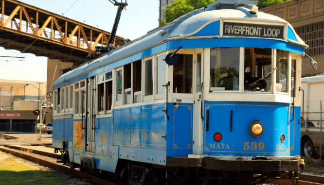 A trolley near a house you can buy in Memphis.