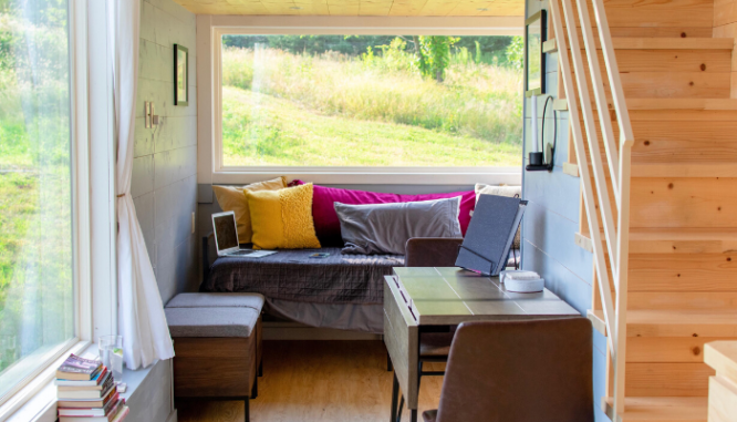 A tiny home with a kitchenette.