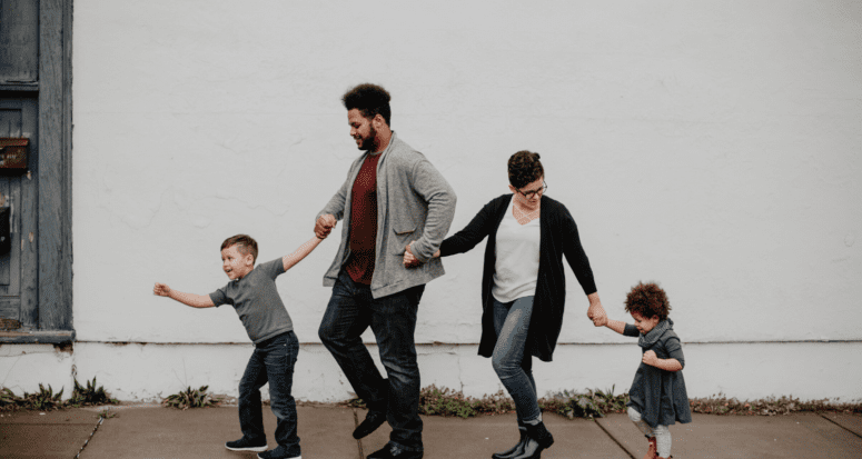 A family of four excited to negotiate on a house.