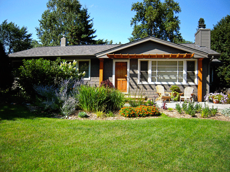 A house with a pergola used to increase curb appeal.
