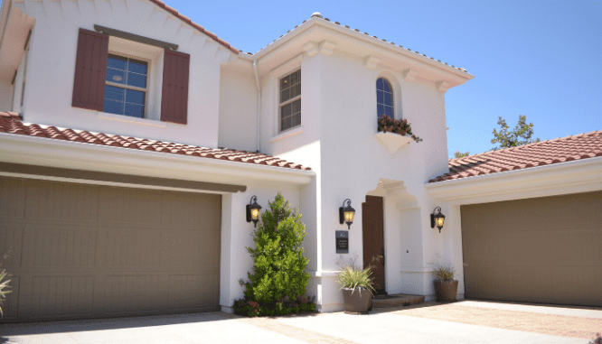 A house with garage doors that could be outdoor eyesores.