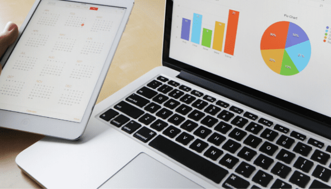 An iPad and laptop showing different statistics.