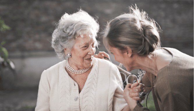 Two seniors discussing moving tips.
