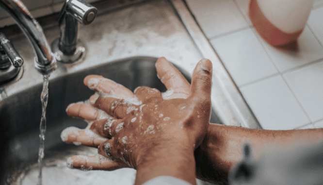 A person washing hands during coronavirus.