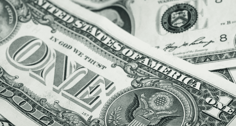 A close up of some U.S. one dollar bills.