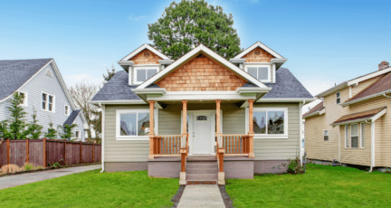 A beige, red, and wooden small house you could do many home improvements on.