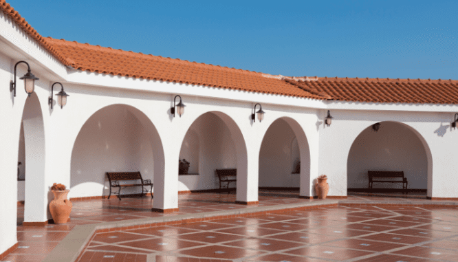 Consider your region when painting the exterior of your house to add value, such as a Spanish red tile roof