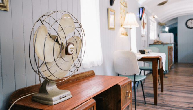 A fan in a room that is a real estate investment.