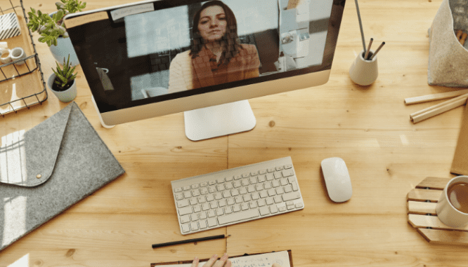 People using a computer to buy a house online.