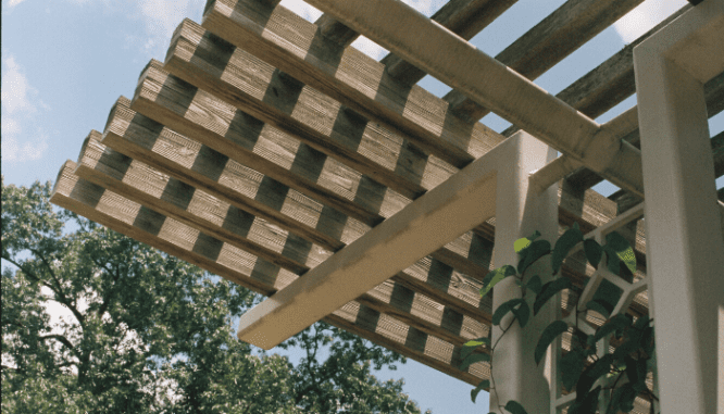 A photo of a pergola that could add visual interest on a house.