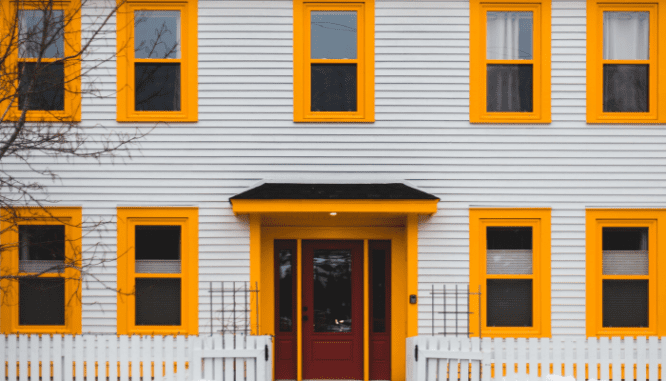 A photo showing brightly colored trim to contrast with light siding.