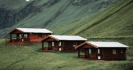 A photo of small dwellings is used to illustrate the topic of building a guest house.