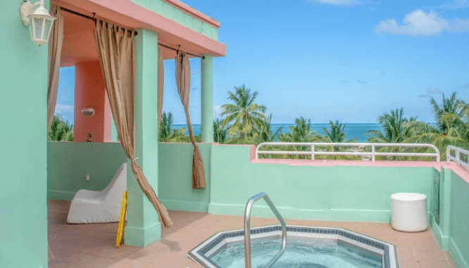 A hot tub outside a house for sale.