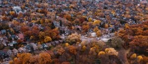 Aerial view of a suburban area with fall foliage