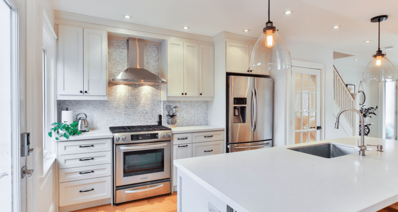 A kitchen with appliances in a house.