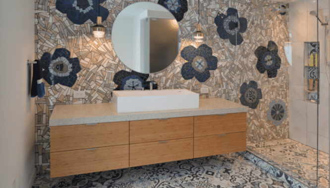 A mosaic tile wall in a bath room showing 2021 home design trends.