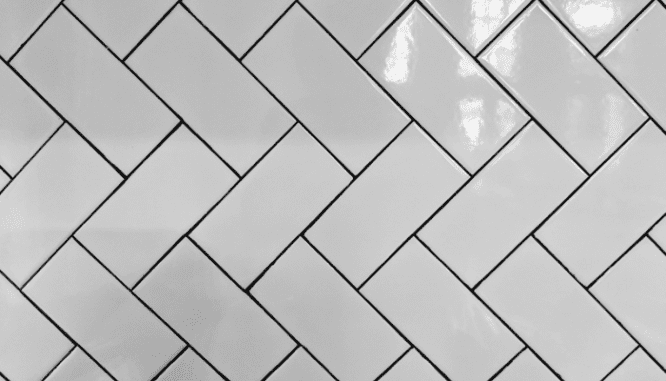 A herringbone pattern of subway tiles.