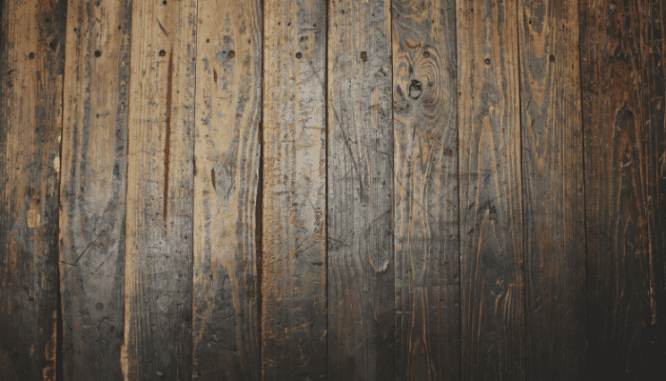 Hardwood floors that need to be fixed in a home.