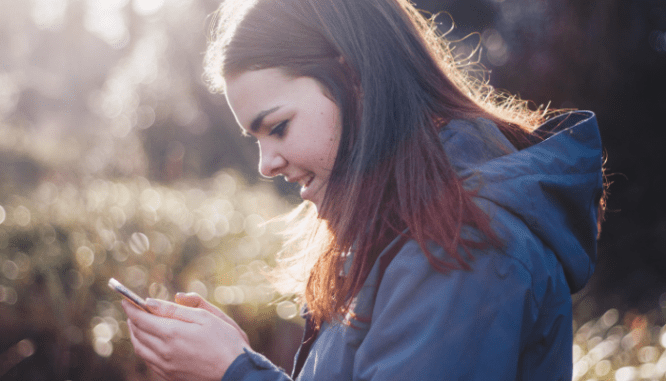 A person using a phone to learn about pmi rates.