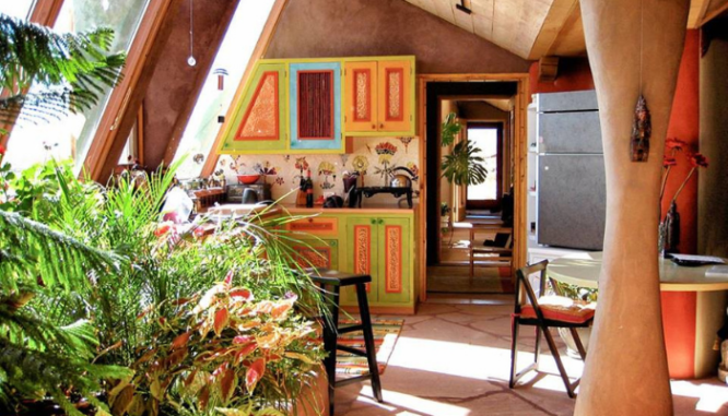 An earthship home with a colorful interior.