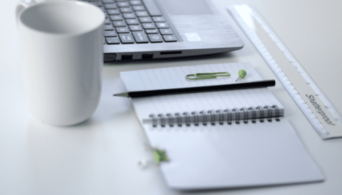 A notebook used to plan a flooring budget in 2021.