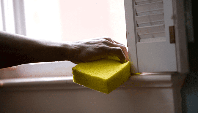 A person cleaning a house for sale.