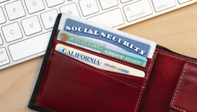 A wallet with an ID that needs to be updated to live in a vacation home.