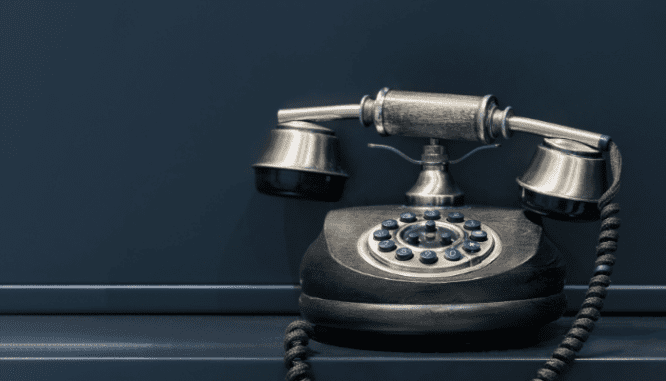 A phone used to contact an agent about a backyard office.