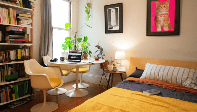 A bedroom in a house with an open floor plan.