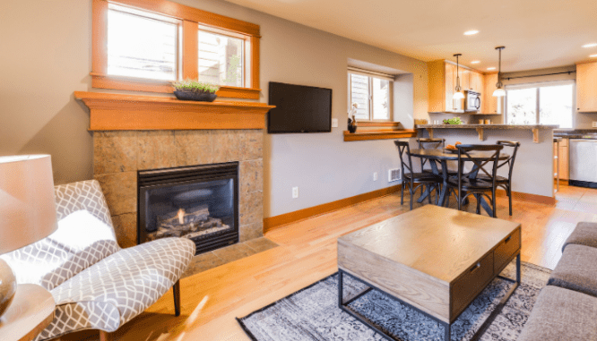 A living room in a house with an open floor plan.