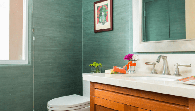 A vanity and toilet used to demonstrate powder room ideas.