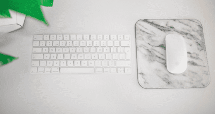 A keyboard used to write real estate agent reviews.