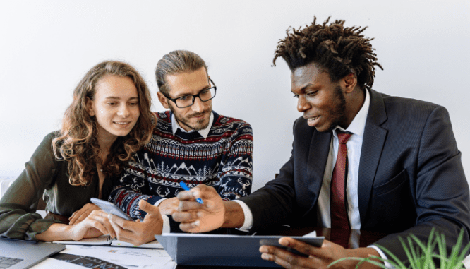 A real estate agent helping a couple buy a home.