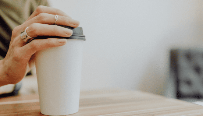 A real estate agent having coffee with a client.