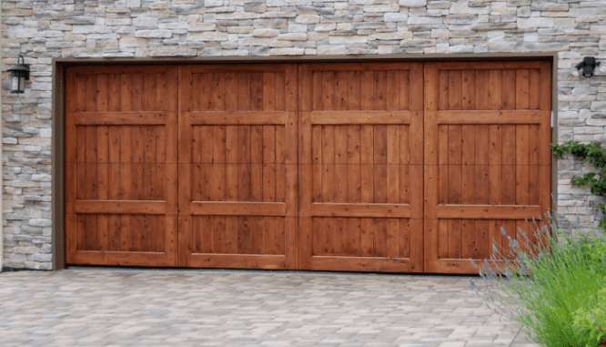 A wood garage door attached to a house with added value.