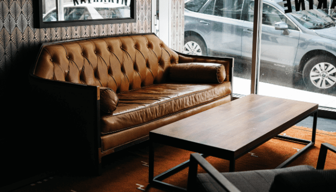 A couch in a room with industrial interior design.
