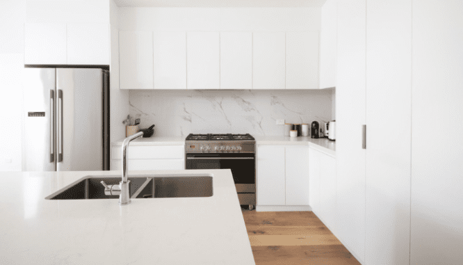 Remodeling your kitchen can include painting cabinets instead of replacing them.