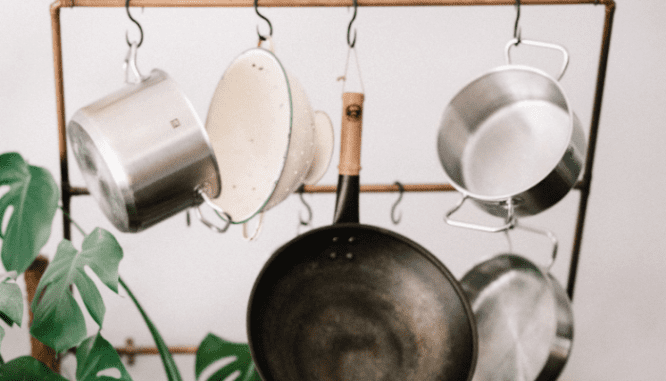 An image of a pot rack in a kitchenette.