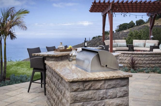 An outdoor kitchen with an ocean view.