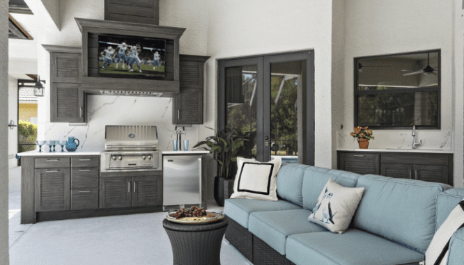 A outdoor kitchen with a built-in kegerator.